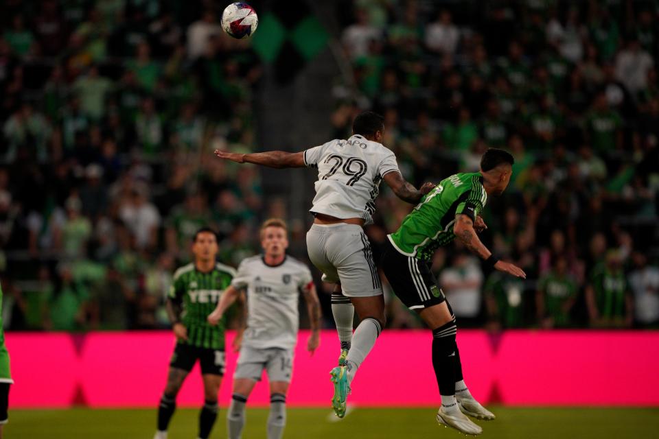 San Jose Earthquakes defender Carlos Akapo, center, heads the ball during Saturday night's match.  El Tree suffered through some uncharacteristic defensive lapses, which were enough to spoil a rare (for this season) two-goal night for the offense.