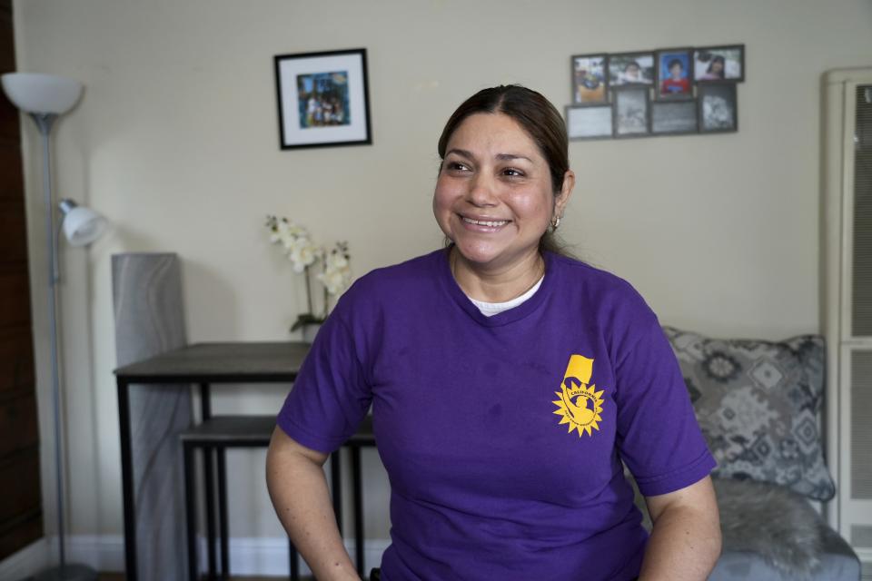 Ingrid Vilorio, who works at a Jack in the Box restaurant, sits in her home in Hayward, Calif., Friday, March 22, 2024. She's among hundreds of thousands of California fast-food workers who will be paid $20 an hour starting Monday, April 1. (AP Photo/Terry Chea)