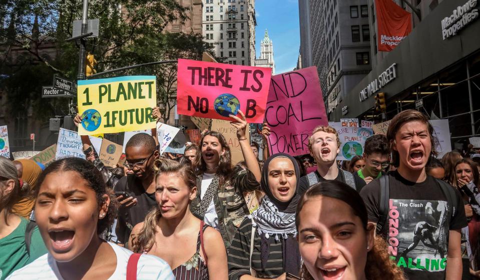 In this Sept. 20, 2019 photo, climate change activists participate in an environmental demonstration as part of a global youth-led day of action in New York.