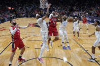 New Orleans Pelicans forward Brandon Ingram (14) goes to the basket between Los Angeles Lakers forward Anthony Davis and guard Patrick Beverley (21) in the first half of an NBA basketball game in New Orleans, Saturday, Feb. 4, 2023. (AP Photo/Gerald Herbert)