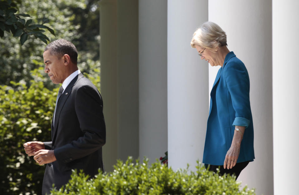 President Barack Obama, followed by Elizabeth Warren, head the Consumer Financial Protection Bureau, walks to the  Rose Garden of the White House in Washington,  Monday, July 18, 2011, where he announced the nomination of former Ohio Attorney General Richard Cordray to serve as the first director of the Consumer Financial Protection Bureau (CFPB).  (AP Photo/Pablo Martinez Monsivais)