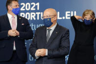 Portuguese Foreign Minister Augusto Santos Silva waits to take part in a group photo with EU Commissioners in Lisbon, Friday, Jan. 15, 2021. Santos Silva considered "without logic" the U.K.'s decision to ban travel from Portugal to ensure a new variant of COVID-19 found in Brazil doesn't derail the country's vaccination program. (AP Photo/Armando Franca)