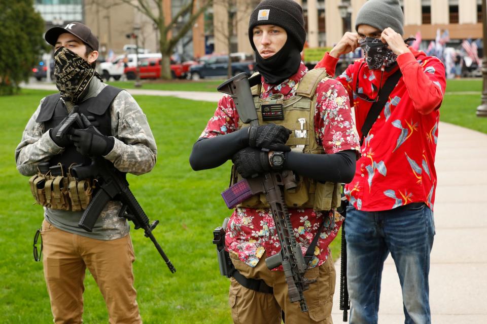 Heavily armed anti-lockdown protesters began showing up at the Michigan State Capitol in April around the time President Donald Trump tweeted "LIBERATE MICHIGAN." (Photo: JEFF KOWALSKY via Getty Images)