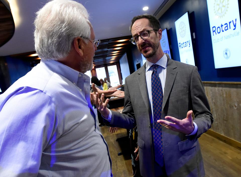 Mayoral candidate Freddie O’Connell talks with a Rotary members as he campaigns at a Rotary meeting Monday, Aug. 28, 2023, in Nashville, Tenn.