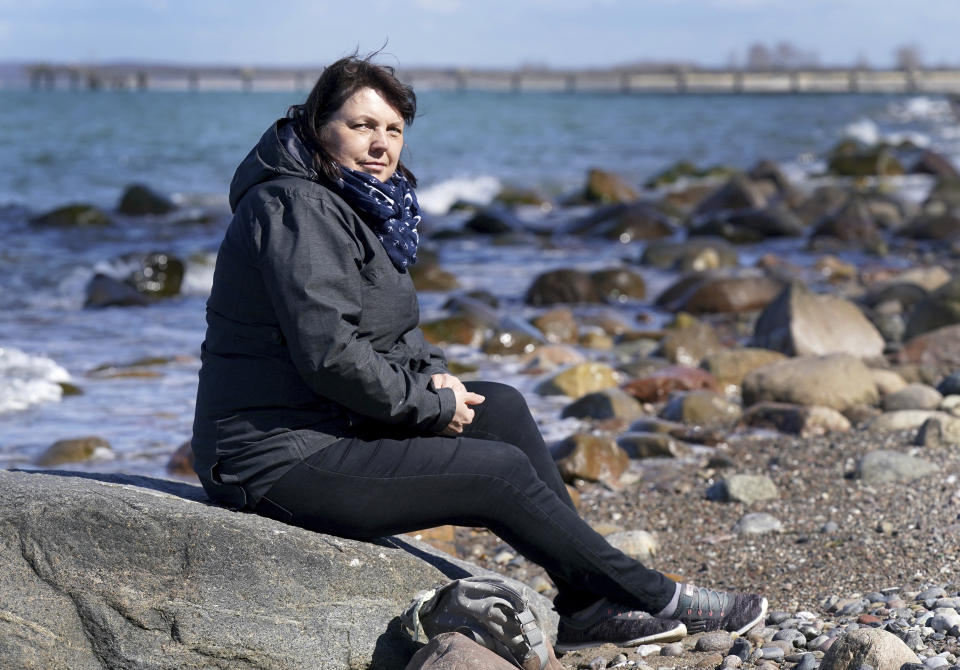 Heike Risch, patient of the 'MEDIAN Clinic Heiligendamm', attends an interview with the Associated Press in Heiligendamm, northern Germany, Wednesday, April 14, 2021. The MEDIAN Clinic, specialized on lung diseases, treats COVID-19 long time patients from all over Germany. (AP Photo/Michael Sohn)