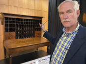 Robin DeGroot, a conservator for Third Coast Conservation in Elmhurst, explains the nuanced work he did on cubby holes in the desk that Abraham Lincoln used to draft the presidential inaugural address Thursday, Sept. 16, 2021 in Springfield, Ill.. The desk that Abraham Lincoln used to draft the presidential inaugural address he delivered on March 4, 1861, on the eve of the Civil War, is on display free to the public. Lincoln needed a quiet place away from well-wishers to write the speech, and his brother-in-law, Clark Moulton Smith, offered him a third-floor storage room in the store he owned on the state Capitol square in downtown Springfield. The state purchased the desk from the Smith family in 1953 and this summer spent $6,300 to have it historically restored and repaired. (AP Photo/John O'Connor)