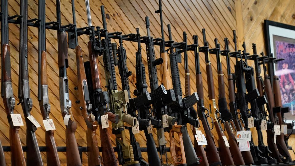 Various guns are displayed at a store on July 18, 2022, in Auburn, Maine. - Robert F. Bukaty/AP