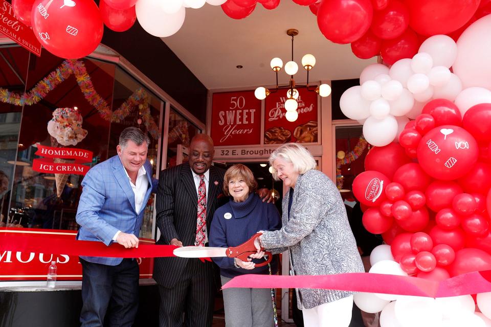 Tim Strickland, Savannah Mayor Van Johnson, Pam Strickland, and Jennifer Strickland cut the ribbon during the grand opening celebration for the newest location of River Street Sweets at 32 E. Broughton Street on March 21.