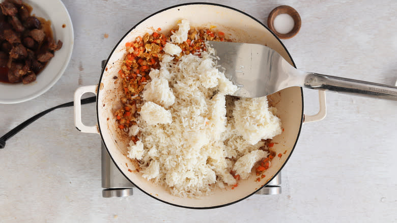 rice in pan with vegetables