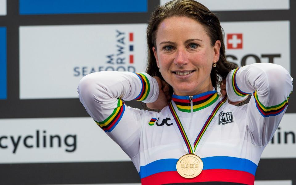 Annemiek van Vleuten celebrates on the podium after winning time trial gold - AFP