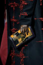 <p>A model carries a yellow patterned clutch from the Bottega Veneta FW18 show. (Photo: Getty Images) </p>