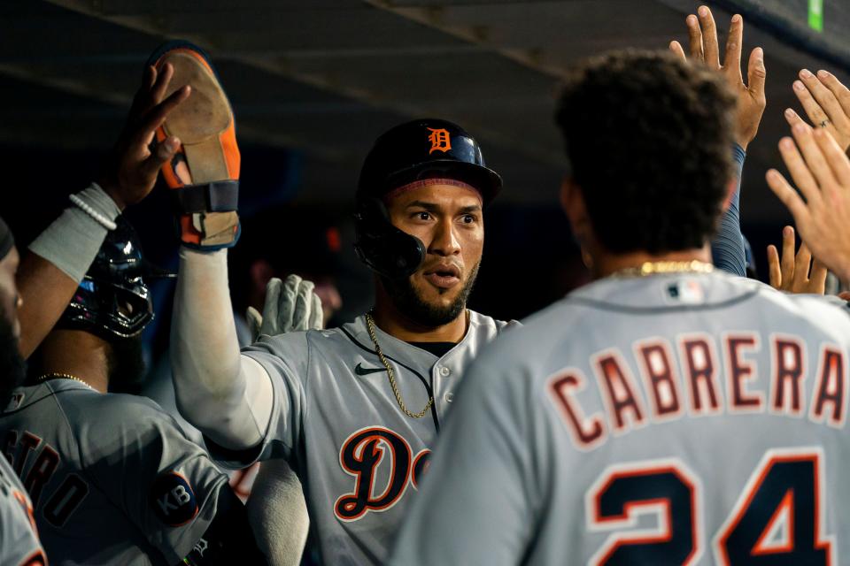 Tigers right fielder Victor Reyes celebrates with teammates after scoring against the Blue Jays during the fifth inning July 29, 2022 at Rogers Centre.