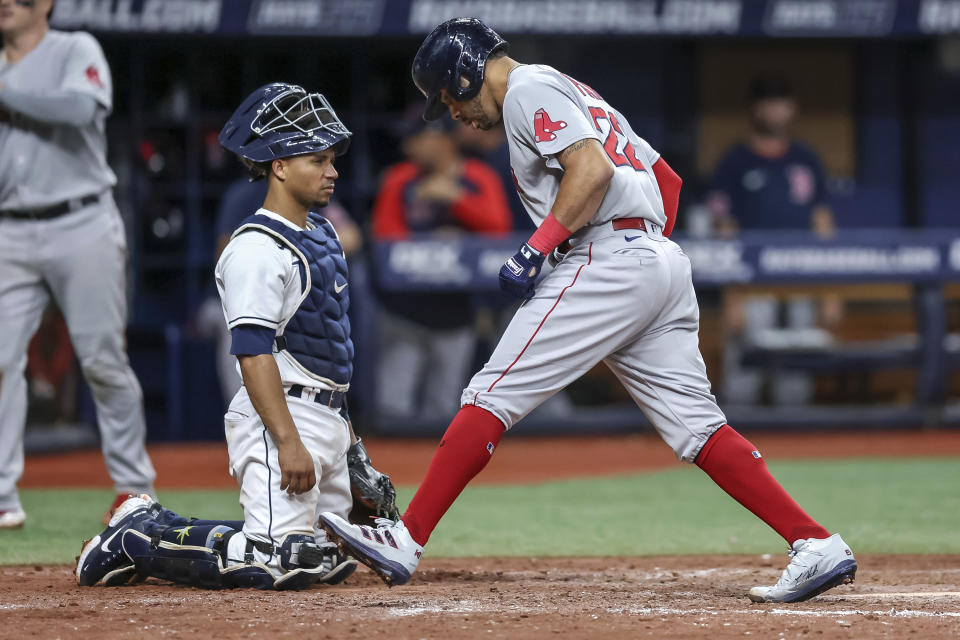 Boston Red Sox's Tommy Pham scores in front of Tampa Bay Rays catcher Francisco Mejia on his two-run home run during the eighth inning of a baseball game Tuesday, Sept. 6, 2022, in St. Petersburg, Fla. (AP Photo/Mike Carlson)