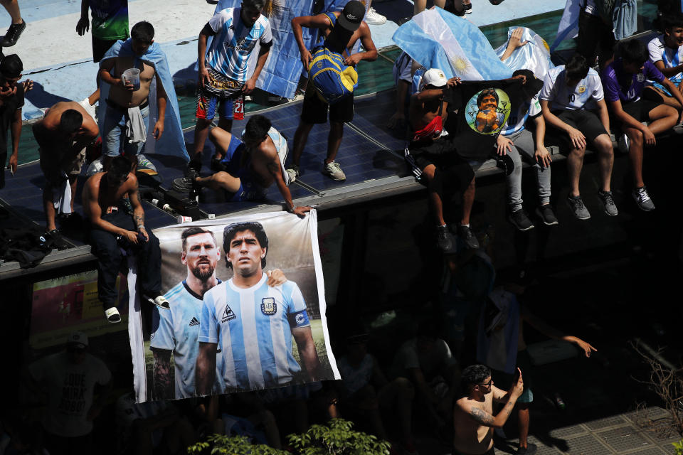 Soccer Football - FIFA World Cup Qatar 2022 - Argentina Victory Parade after winning the World Cup - Buenos Aires, Argentina - December 20, 2022  General view as a banner of Argentina's Lionel Messi and former player Diego Maradona is seen ahead of the victory parade REUTERS/Agustin Marcarian