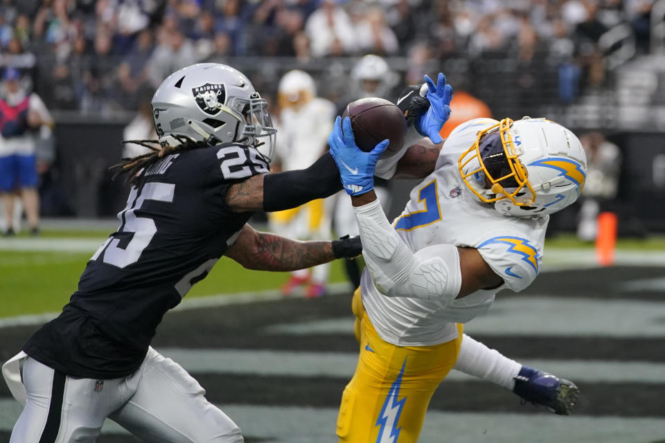 Los Angeles Chargers tight end Gerald Everett (7) tries in vain to pull in a pass in the end zone as Las Vegas Raiders wide receiver Albert Wilson (25) covers during the first half of an NFL football game, Sunday, Dec. 4, 2022, in Las Vegas. (AP Photo/Matt York)