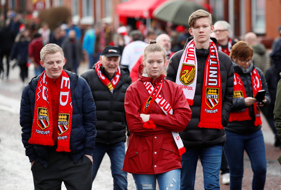 <p>Fans mix outside theground </p>