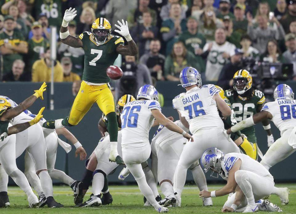 Packers linebacker <a class="link " href="https://sports.yahoo.com/nfl/players/33977" data-i13n="sec:content-canvas;subsec:anchor_text;elm:context_link" data-ylk="slk:Quay Walker;sec:content-canvas;subsec:anchor_text;elm:context_link;itc:0">Quay Walker</a> jumps over the Lions field goal line to try to block the kick during the fourth quarter of the Lions’ 34-20 win on Thursday, Sept. 28, 2023, in Green Bay, Wisconsin.