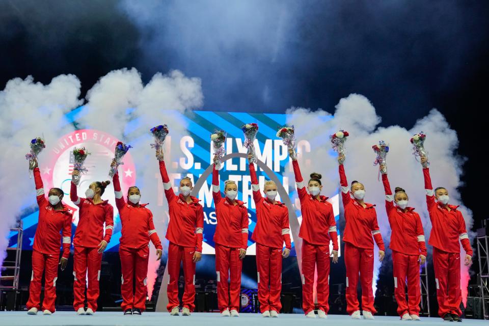 Members of the U.S. Women's Olympic Gymnastic Team and alternates celebrate after the women's U.S. Olympic Gymnastics Trials Sunday in St. Louis. Kara Eaker, third from right, and Leanne Wong, far right, who train at GAGE in Blue Springs, were named as alternates for the U.S. Olympic squad that will compete in Tokyo.