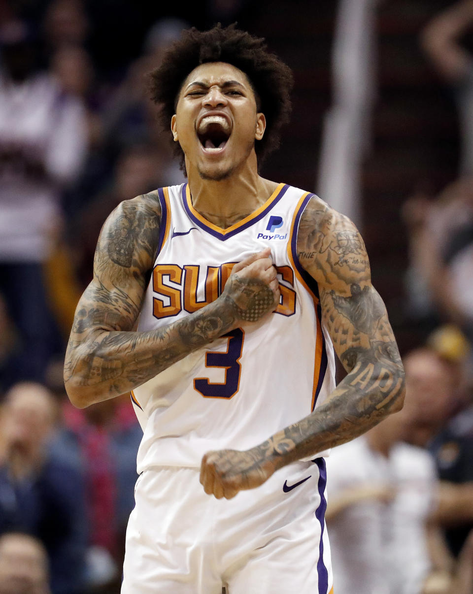 Phoenix Suns forward Kelly Oubre Jr. (3) reacts to a forced turnover against the Milwaukee Bucks during the second half of an NBA basketball game, Monday, March 4, 2019, in Phoenix. (AP Photo/Matt York)