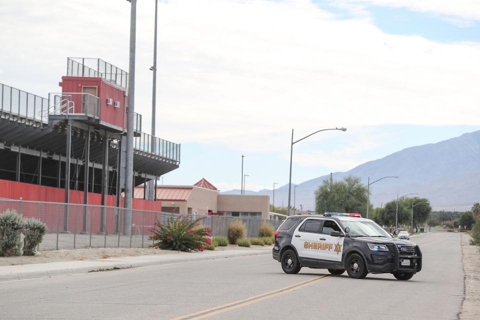 Riverside County Sheriff's officers block the roads around Toro Canyon Middle School and Desert Mirage High School after an unknown incident forced the school's evacuation in Thermal, Calif., Nov. 2, 2022.
