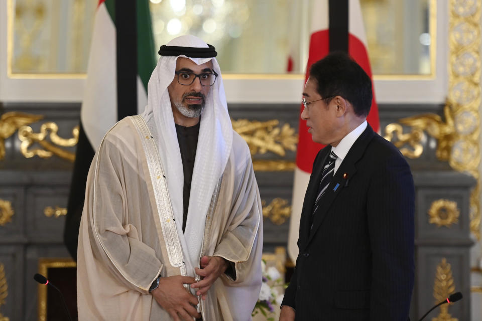Japan's Prime Minister Fumio Kishida, right, and Sheikh Khaled bin Mohamed bin Zayed Al Nahyan, member of Abu Dhabi Executive Council and chairman of Abu Dhabi Executive Office, pose for the photographers prior to their bilateral meeting at Akasaka Palace State Guest House in Tokyo Monday, Sept. 26, 2022. (David Mareuil/Pool Photo via AP)