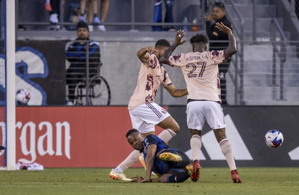 Portland Timbers midfielder Dairon Asprilla (27) fouls San Jose Earthquakes midfielder Carlos Gruezo, on ground, resulting in a free kick during the first half of an MLS soccer match in San Jose, Calif., Saturday, June 17, 2023. (AP Photo/John Hefti)