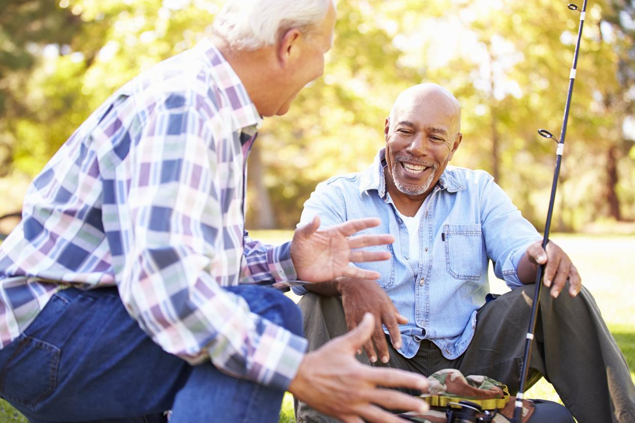 two senior men with fishing rod