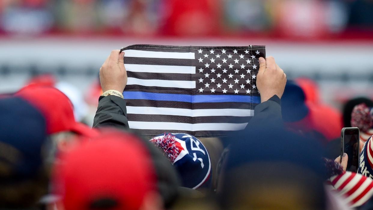 Originally intended to recognize the work police services do to protect communities, and honour fallen officers,  the “thin blue line” symbol has been co-opted and adopted by white nationalist groups opposing the fight for racial equity and anti-racism initiatives. (Getty Images)