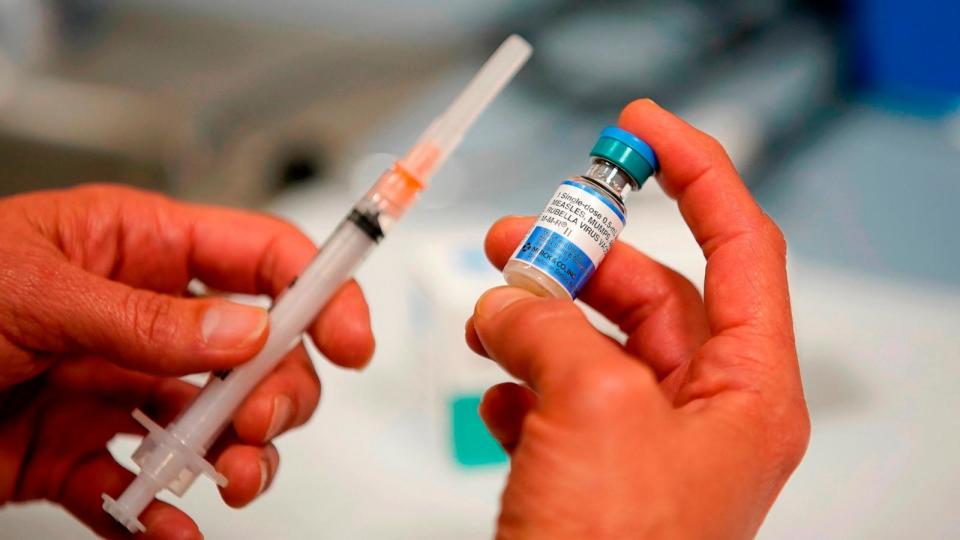 PHOTO: A one-dose bottle of measles, mumps and rubella virus vaccine, made by MERCK, is held up at the Salt Lake County Health Department on April 26, 2019 in Salt Lake City, Utah. (George Frey/Getty Images)