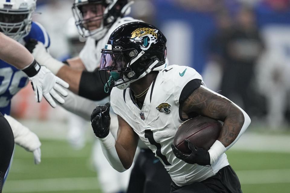 Jacksonville Jaguars running back Travis Etienne Jr. runs during the first half against the Indianapolis Colts.