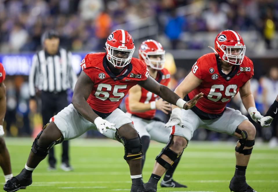 Jan 9, 2023; Inglewood, CA, USA; Georgia Bulldogs offensive lineman Amarius Mims (65) and offensive lineman Tate Ratledge (69) against the TCU Horned Frogs during the CFP national championship game at SoFi Stadium. Mandatory Credit: Mark J. Rebilas-USA TODAY Sports