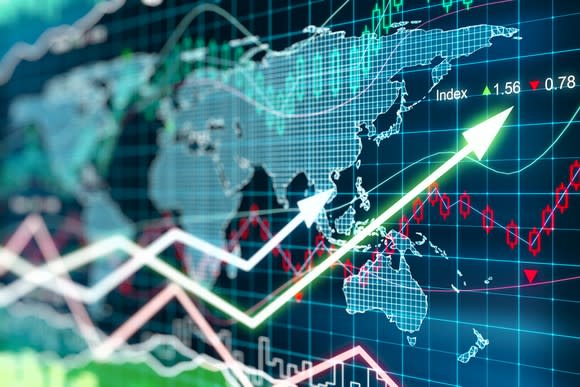 Stock market data and charts overlaying a digital world map