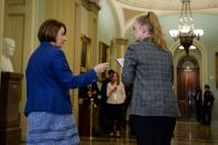 Democratic U.S. presidential candidate, Sen. Amy Klobuchar (D-MN) walks from the Senate floor for a brief recess during the day's Senate impeachment trial of President Donald Trump in Washington