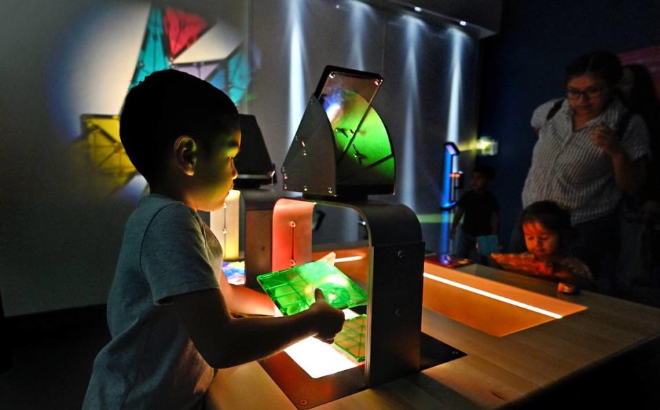Cristiano Santos, 4, plays with light projections in the light lab at the Modesto Children’s Museum in Modesto, Calif., Thursday, Sept. 28, 2023.