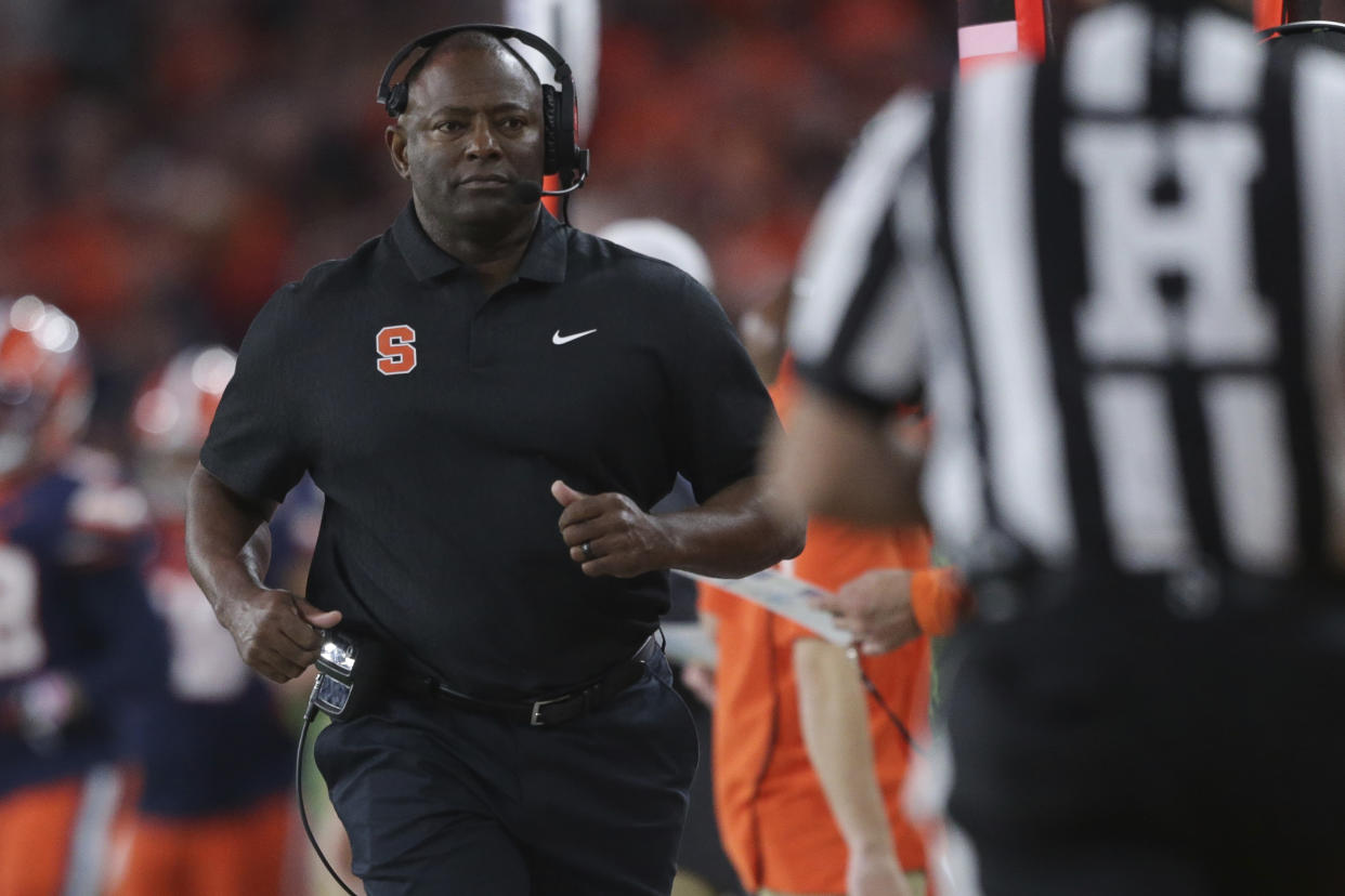 FILE - Syracuse head coach Dino Babers jogs along the sideline during the second half of the team's NCAA college football game against Florida State on Saturday, Nov. 12, 2022, in Syracuse, N.Y. Minnesota plays Syracuse in the Pinstripe Bowl on Thursday, Dec. 29. (AP Photo/Joshua Bessex, File)