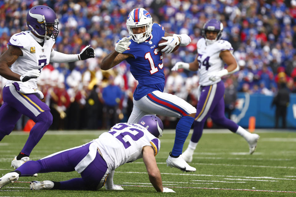 Buffalo Bills wide receiver Gabe Davis (13) tries to evade Minnesota Vikings cornerback Patrick Peterson and safety Harrison Smith (22) in the first half of an NFL football game, Sunday, Nov. 13, 2022, in Orchard Park, N.Y. (AP Photo/Jeffrey T. Barnes)