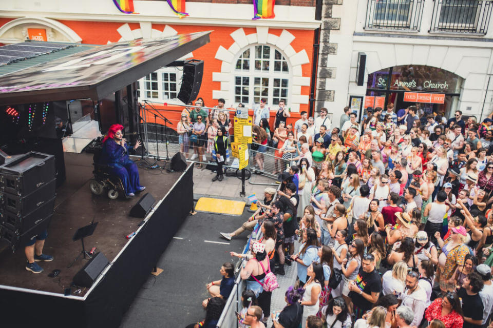 A person in a wheelchair addresses the crowd