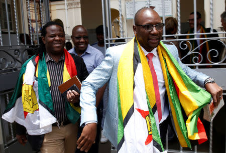 Activist Pastor Evan Mawarire leaves the High Court after he was found not guilty of subversion in Harare, Zimbabwe, November 29, 2017. REUTERS/Philimon Bulawayo