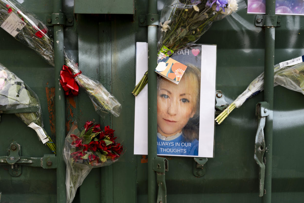 Floral tributes at the scene in Rowdown Fields, New Addington, where remains belonging to Sarah Mayhew were found. (PA)