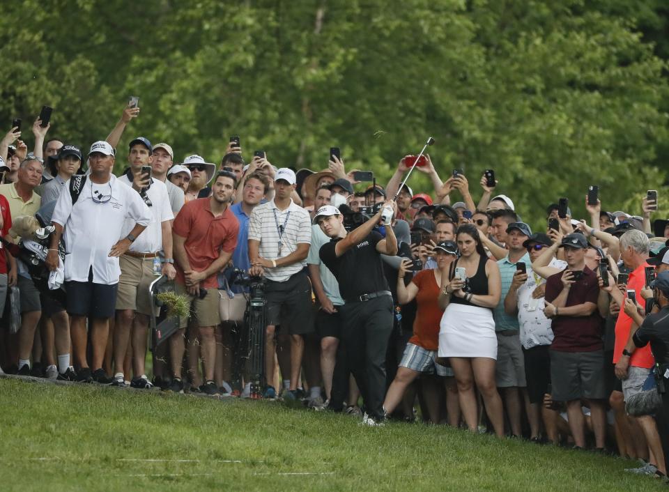 Patrick Cantlay hits out of the gallery on 18 during the final round of the Memorial Tournament at Muirfield Village Golf Club in Dublin, Ohio on Sunday, June 6, 2021. 