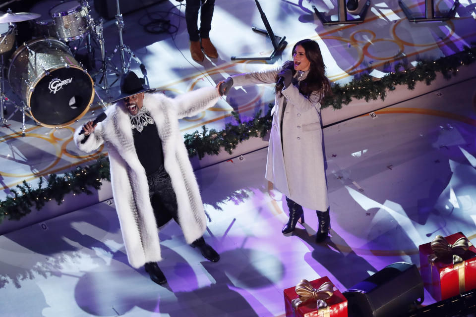 Billy Porter, left, and Idina Menzel perform during the 87th annual Rockefeller Center Christmas Tree lighting ceremony, Wednesday, Dec. 4, 2019, in New York. (AP Photo/Kathy Willens)