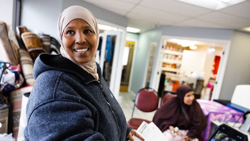 Fadumo Abdulkadir shows a video of her friend Khadijah Wasuge at the Somali Community Self Management Agency in Salt Lake City on Thursday, Jan. 26, 2023.