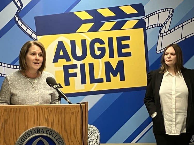 Augustana provost Dianna Shandy (left) speaks at the Friday morning event as film program director Stacy Barton looks on.