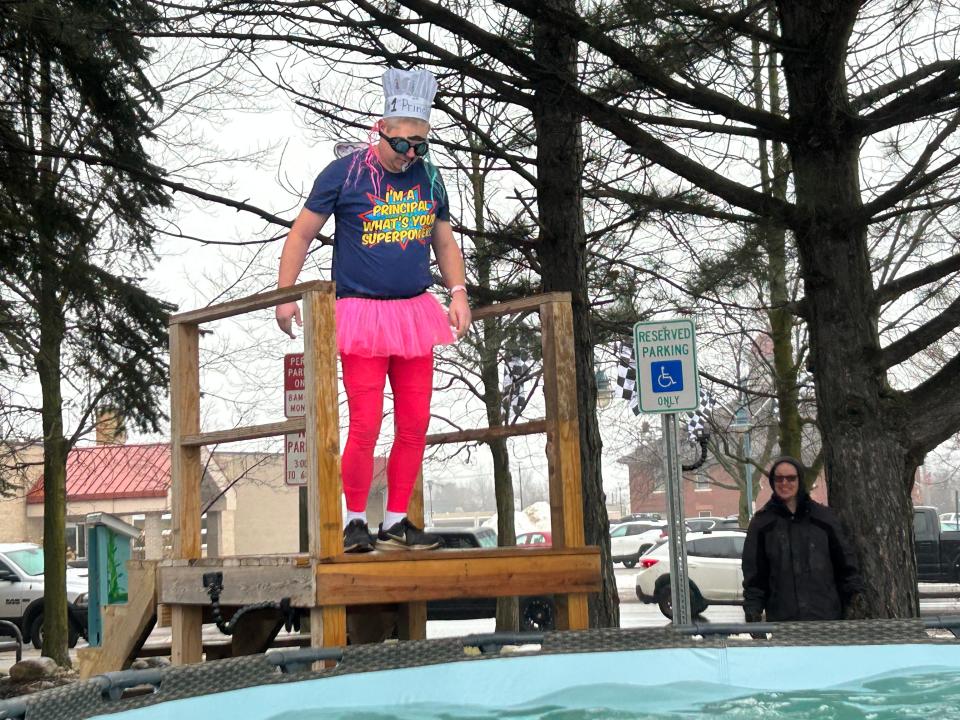 Sault teacher Carl McReady prepares to jump into the water while wearing an outfit designed especially for him by his students.