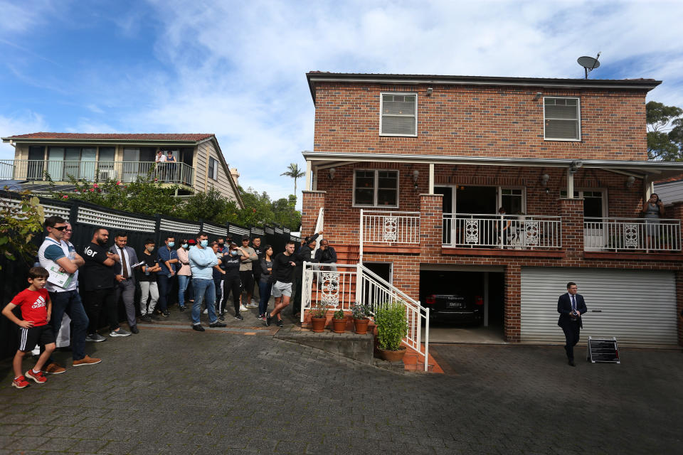 SYDNEY, AUSTRALIA - MAY 08: Auctioneer Jesse Davidson counts down a bid during an auction of a residential property in the suburb of Strathfield on May 08, 2021 in Sydney, Australia. Property prices continue to rise across Australia with house prices up almost 27 percent compared to five years ago. Record low interest rates have also seen a surge in home loan applications in the last year. (Photo by Lisa Maree Williams/Getty Images)