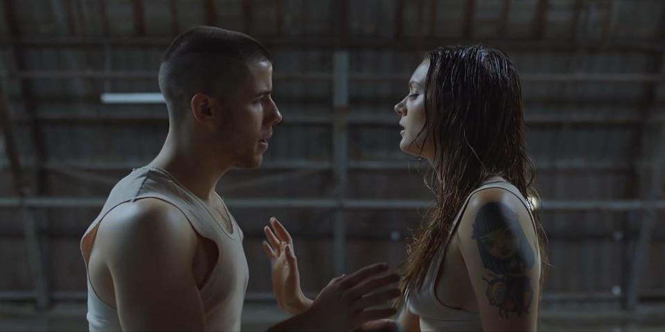Nick Jonas and Tove Lo with their bodies in front of one another in the music video for "Close."