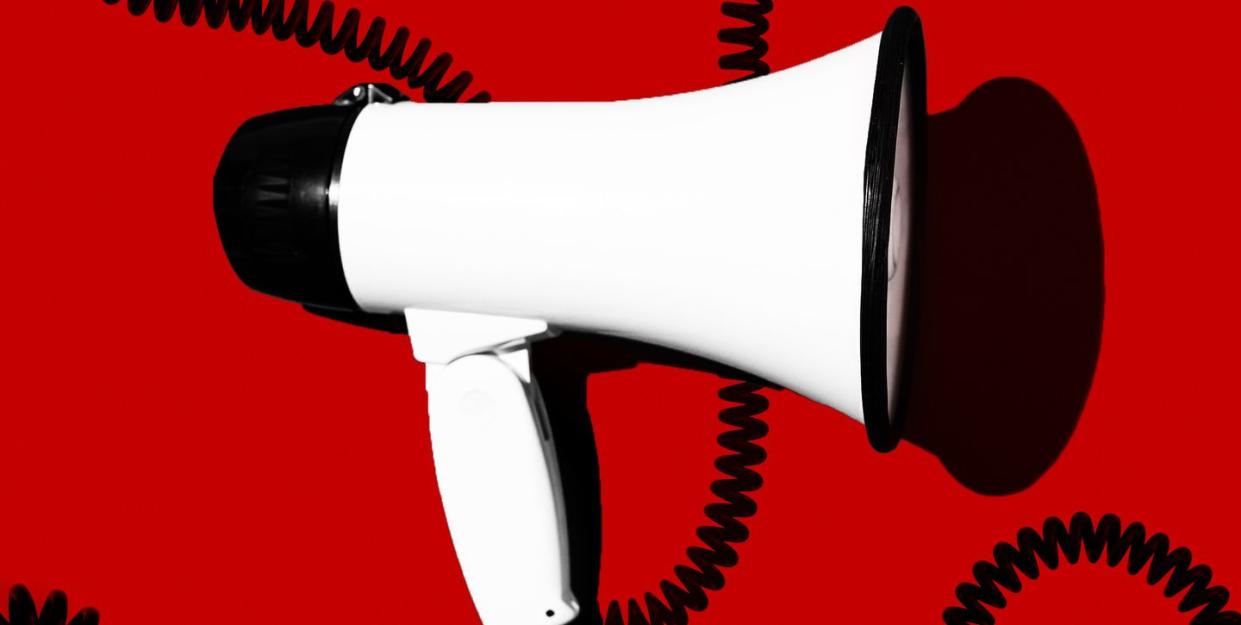 megaphone on red background with black coils