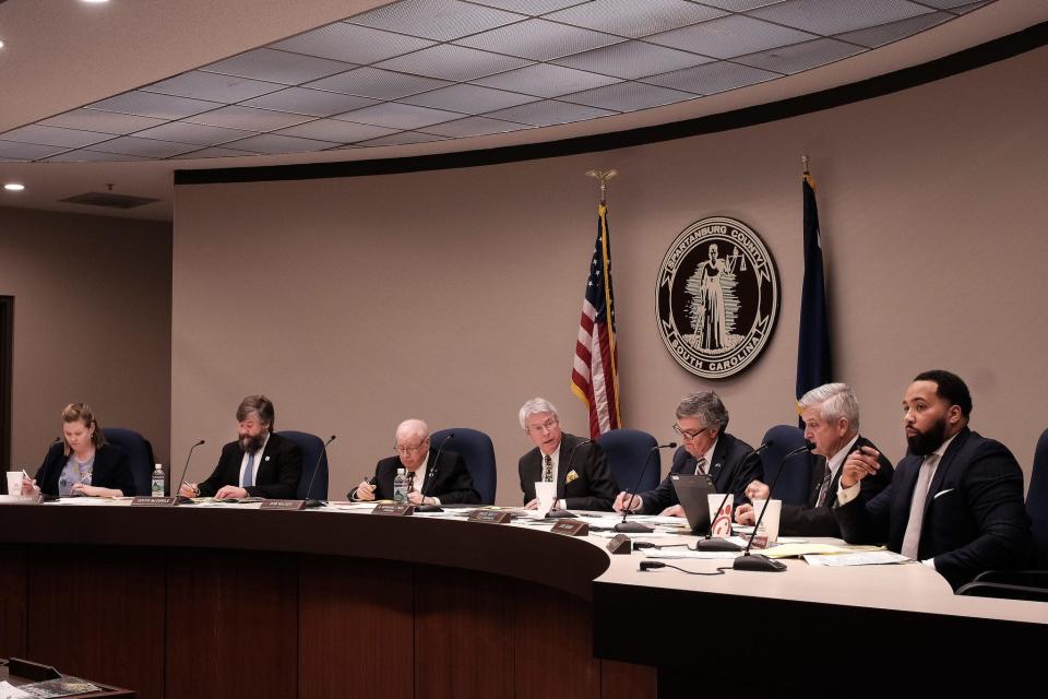 Spartanburg County Council members, including (from left to right) Jessica Coker, Justin McCorkle, Bob Walker, Manning Lynch, David Britt, Jack Mabry, and Monier Abusaft, meet during a council session at the Spartanburg County Administration Building in Spartanburg, Monday evening, February 21, 2022. 