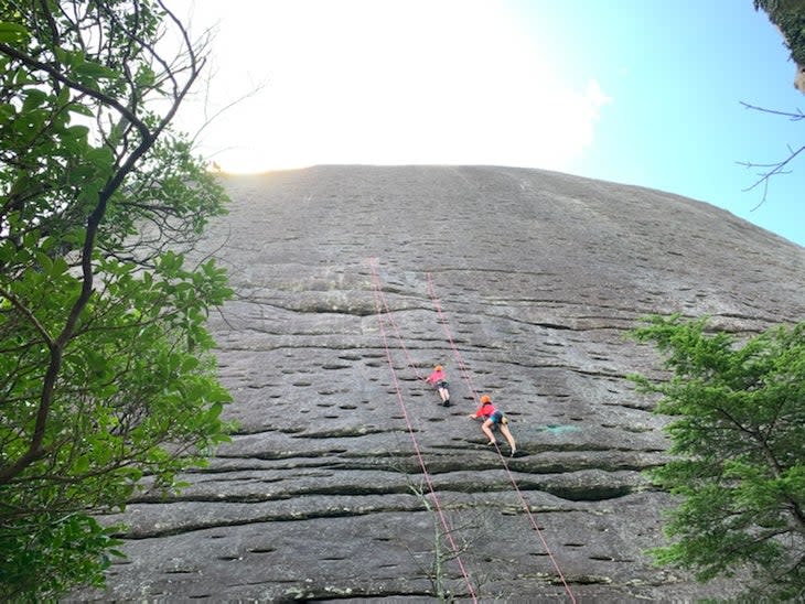Rock climbers at Looking Glass Rock, North Carolina.