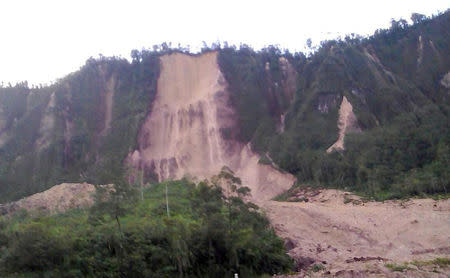 FILE PHOTO - A supplied image shows a landslide and damage to a road located near the township of Tabubil after an earthquake that struck Papua New Guinea's Southern Highlands, February 26, 2018. Jerome Kay/Handout via REUTERS/File Photo